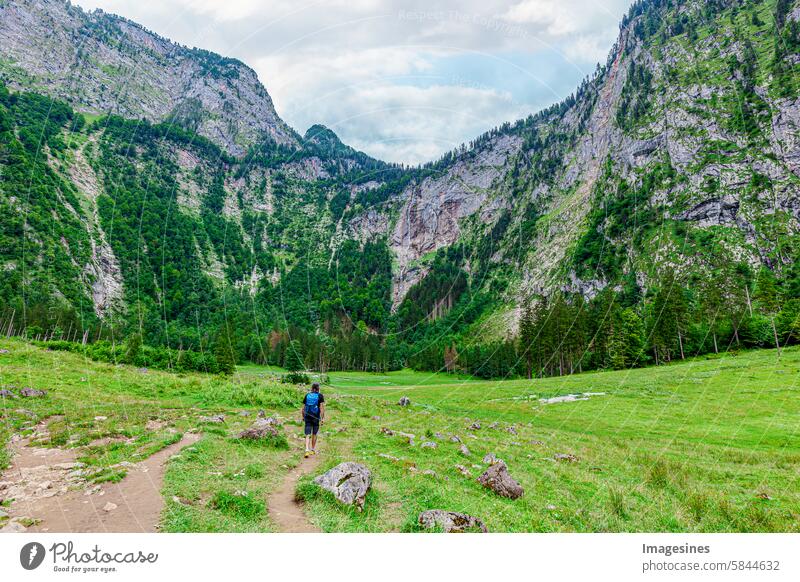 Man hikes to the Röthbach Falls waterfall. Valley near the Königssee, the highest waterfall in Germany. Located behind the Königssee and the Obersee. Berchtesgaden, Bavaria, Germany
