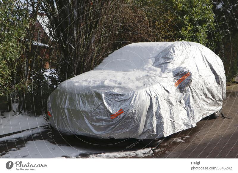 Closed and veiled car motor vehicle shrouded Protection Protective cover Winter Snow Roadside Tree shrub turned off Street Parking Car Vehicle Deserted