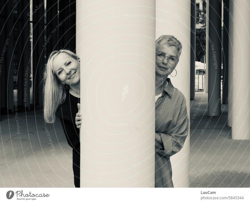 UT Leipzig - bright to cloudy | A pillar to hide behind women two women Column Lean Hide look out lean laughing women muck about Together Good mood Happy