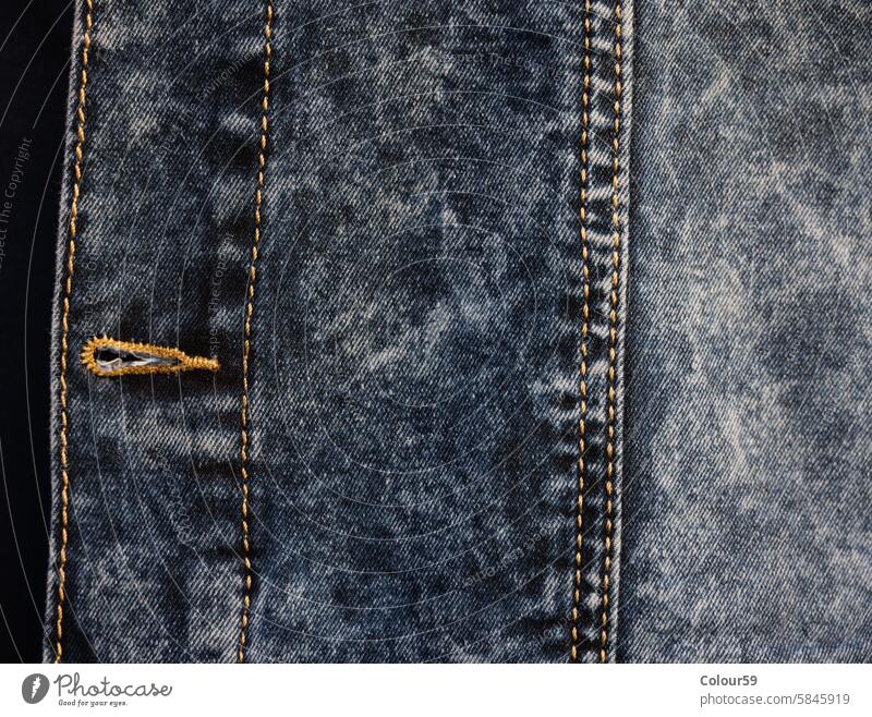 Buttonhole of a denim jacket fashionable nobody object stylish pattern modern apparel casual textile fabric style detail cotton garment texture blue background