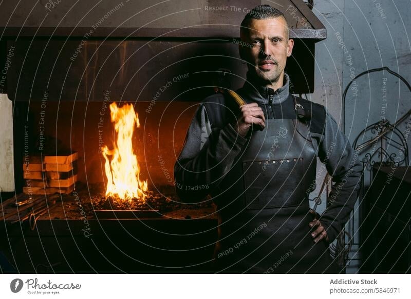Confident Blacksmith in His Workshop with Fiery Forge blacksmith man confident workshop fire forge anvil hammer male apron craftsmanship artisan metalwork