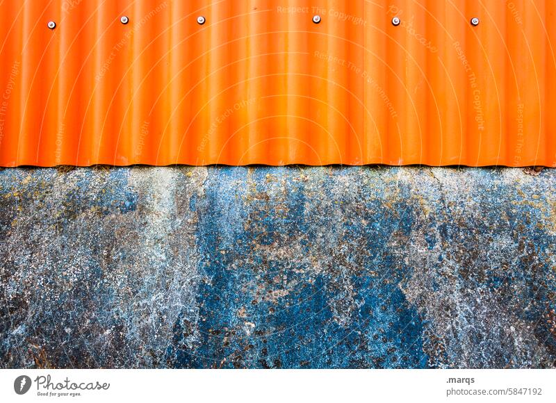 orange on blue Corrugated sheet iron Metal Orange Wall (building) Blue Contrast Colour Old Weathered Structures and shapes Decline