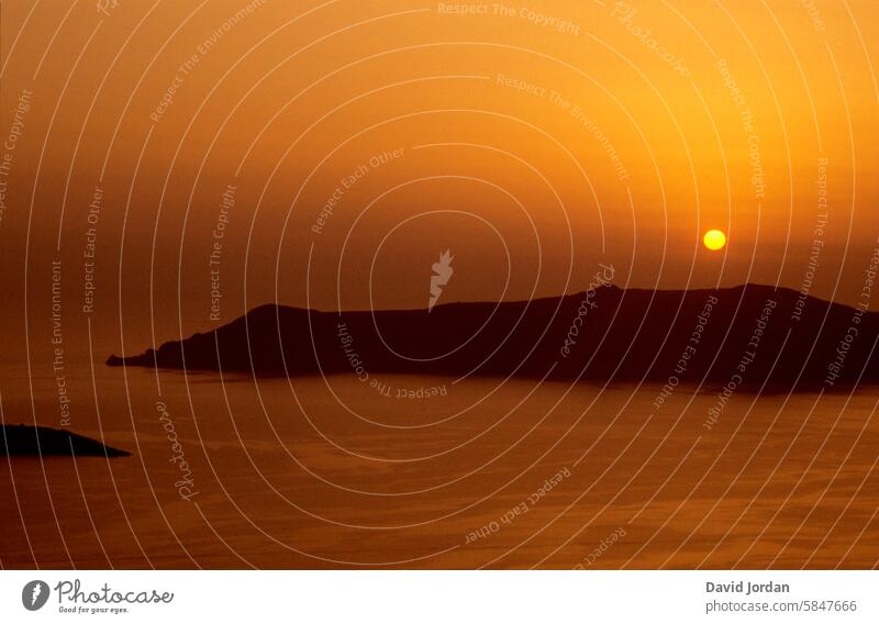 Orange sunset over an island in the Aegean Sea Sunset golden luminescent Island Ocean impressively beautiful Calm decelerate vacation rest To enjoy Greece