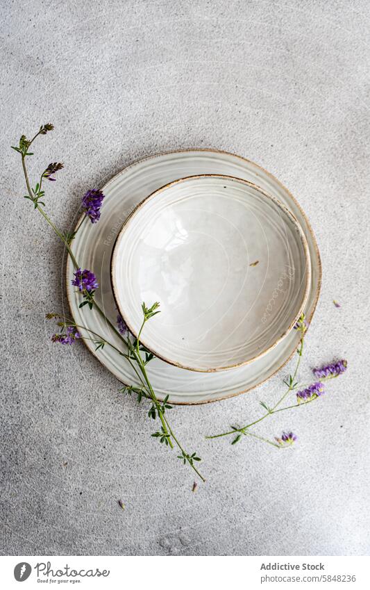 Minimalist summer table setting with wildflowers minimalist alfalfa nature vintage plate decoration concrete texture simplicity floral design top view