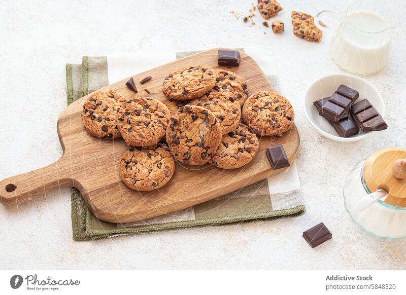 Chocolate Chip Cookies on a Wooden Board Comfort food Cozy Edible Home Inviting Treat baked baked goods brown chewy chocolate chip cookies chocolate chunks