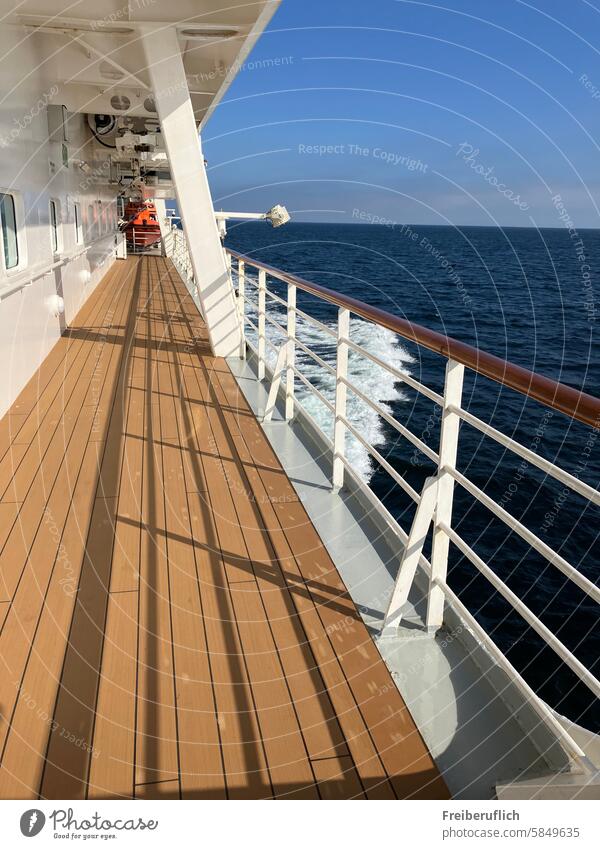 View of the sea during the day from the outside deck on the port side of the ship outer deck Ocean Sky Waves Sun Shadow Navigation beautiful day fresh air