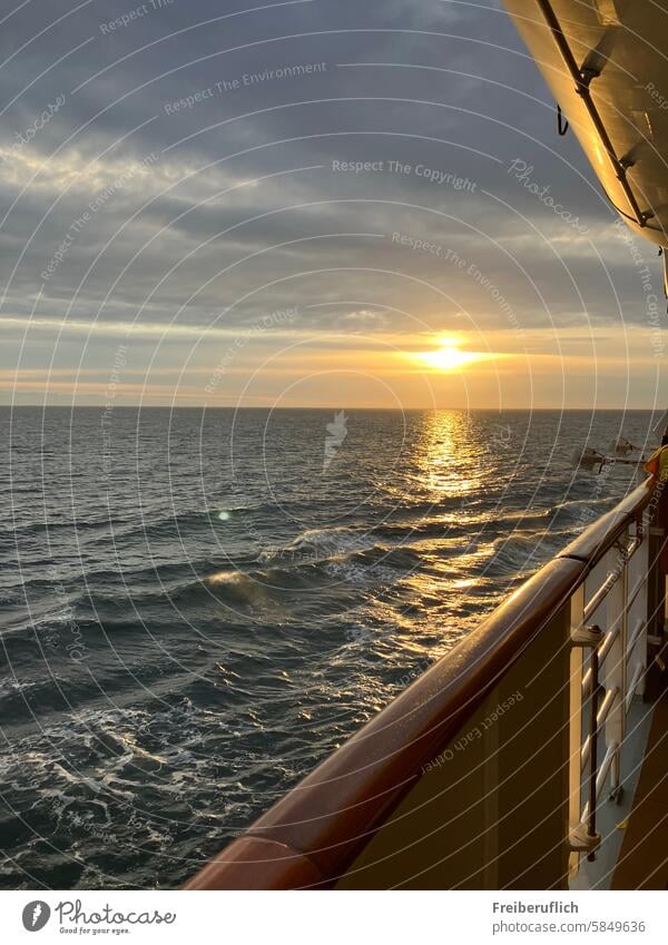 Sunset on a ship by the sea Railing Ocean Waves Water Clouds Moody Atmosphere rail romantic fresh air Sky evening mood