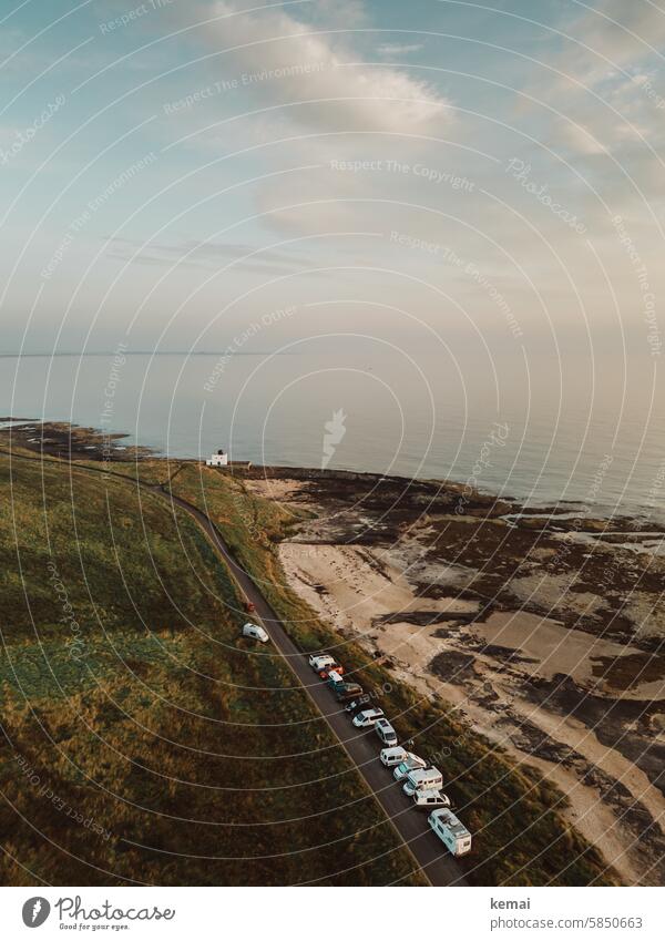 Camping by the sea cars Parking lot Street Ocean Beach Lighthouse England coast Green Brown vacation camp Landscape Vacation & Travel Summer UAV view