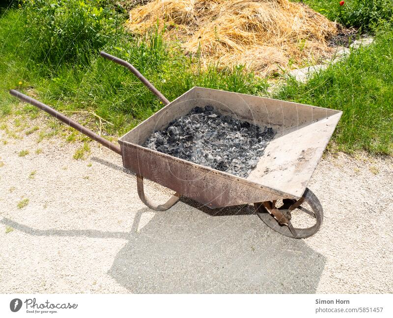 Ashes in an old wheelbarrow ash Wheelbarrow Burnt remnants Farm Agriculture Old Manure heap Gardening Rural stable useful utilization Disposal transport Tool
