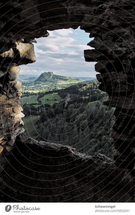 Window of a castle ruin with a view of the Hegau Ruin Opening Vantage point hegau Castle ruin