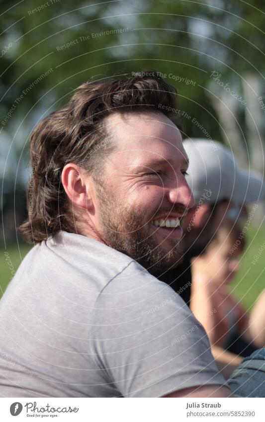 Cool hairstyle Man Curly mullet Beard Laughter cheerful Congenial Hipster Man masculine Summer out Guy with friends at the same time Hair good-looking portrait