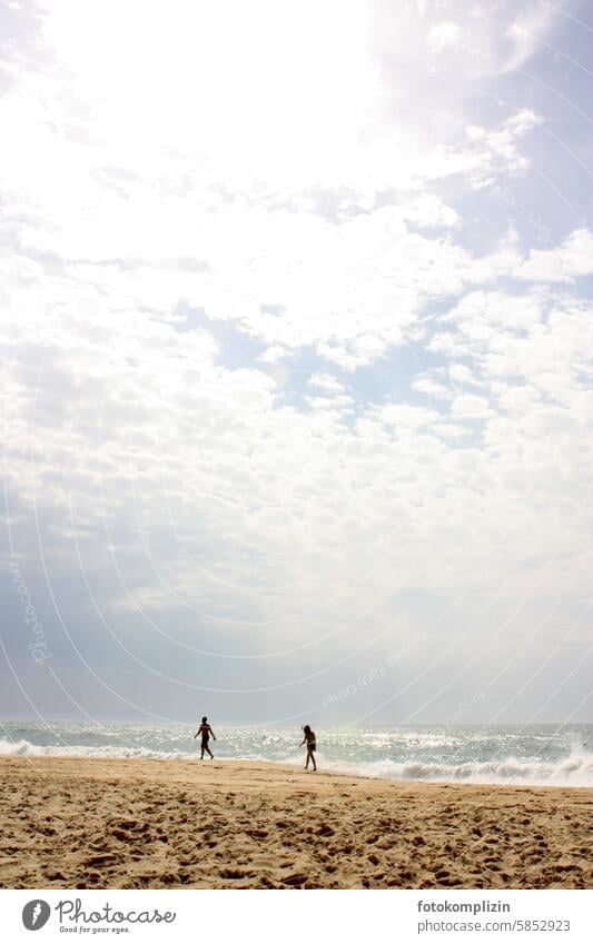 Couple hiking on the beach stroll vacation Walk on the beach relation To go for a walk Pair relationship Beach Hiking Sky Sand people in common Together Love