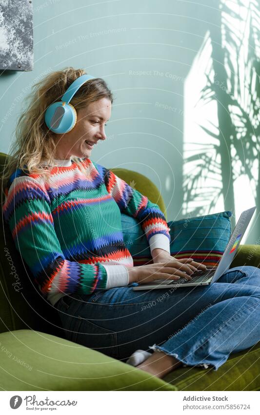 Young woman working remotely with laptop and headphones sofa smart working home remote work comfortable green nature illustration shadow seated casual