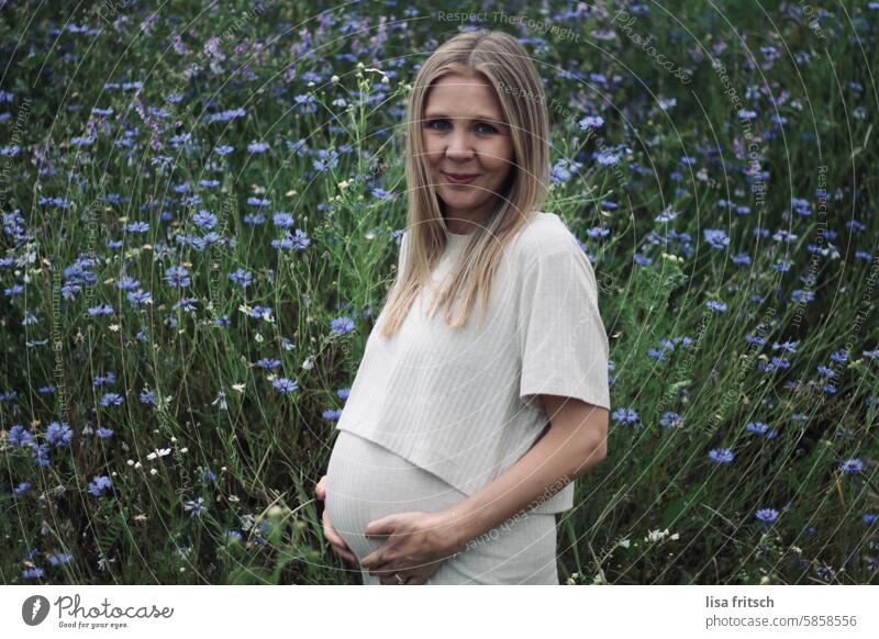 WOMAN - PREGNANT - BABY BUMP Woman pregnancy Cornflower Blonde Long-haired pretty youthful Pregnant Happy Stomach maternity Adults Smiling Attractive expectant