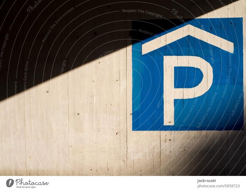 Sign 314-50 for parking garage with light and shade Multi-storey parking garage Signs and labeling Parking garage Wall (building) Shadow Sunlight