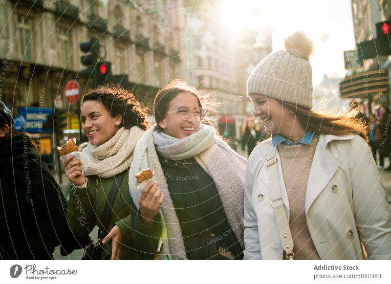 Family enjoying a sunny winter day in London london family women street laugh ice cream city happiness journey travel vacation casual urban outdoor friendship