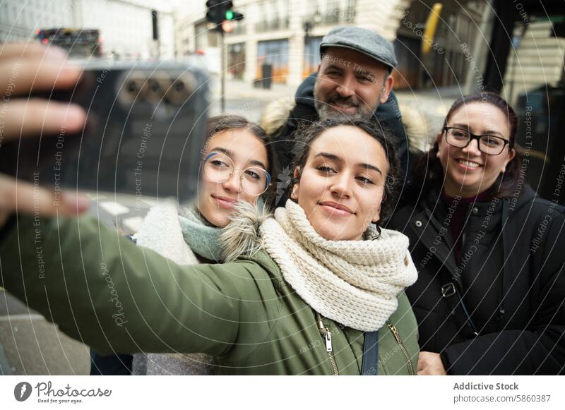 Multigenerational family taking a selfie in London london multigenerational city smile happy travel vacation outdoor smartphone bonding daughters leisure