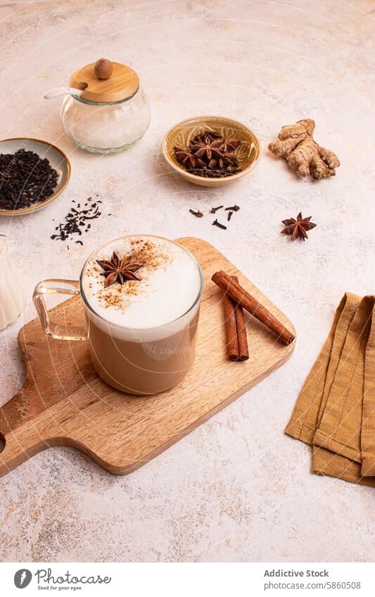 Warm Chai Latte with Spices on Wooden Board indian ceremony horizontal tea preparation wellness cream shadow drink warm blend flavor herb oriental milk foam