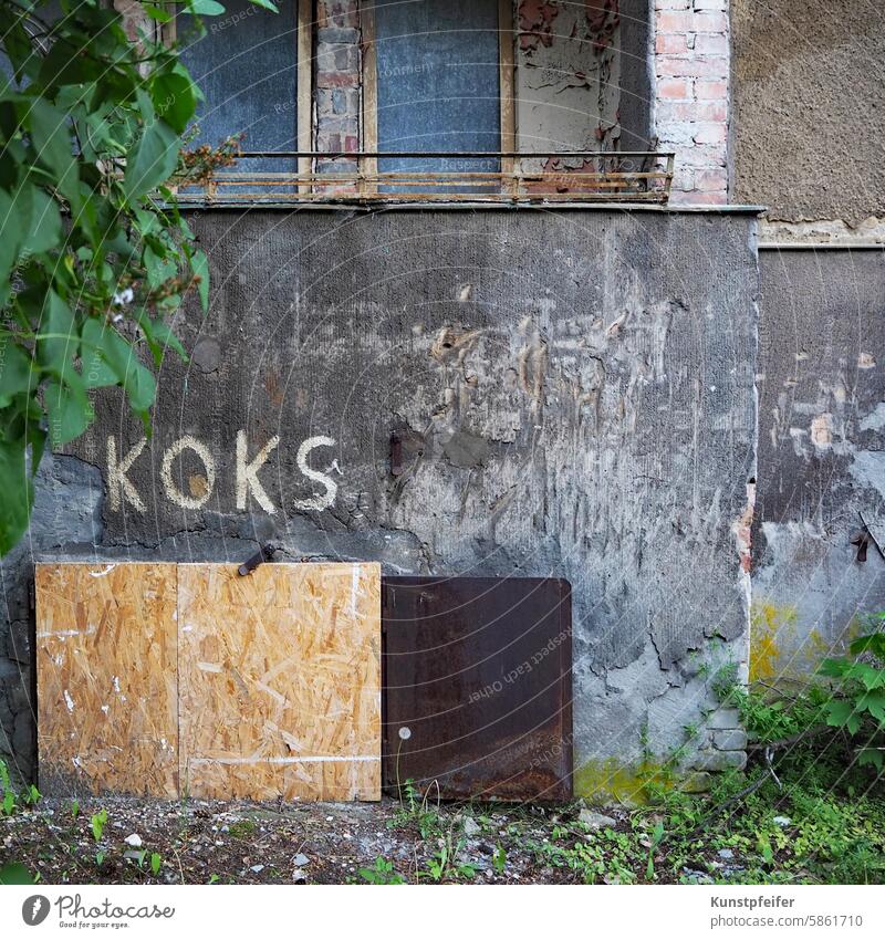 When coal was still being delivered ... Dilapidated Berlin apartment building with "Koks" written on it. Coal Heat Warmth heat source kiln Heating by stove coke