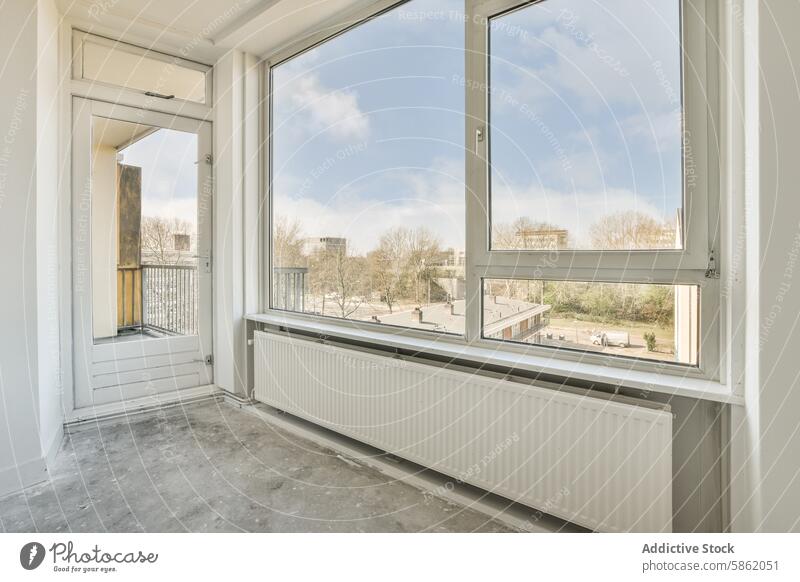 Bright empty room with open balcony door at Honselerdijkstraat 26 window view spacious open door neighborhood apartment honselerdijkstraat interior sunlight