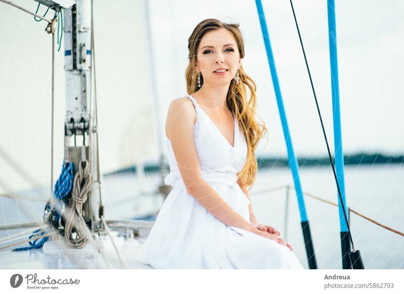 young girl on deck of sailing wooden yacht white day summer walk swim river sea water dress together waves wind blue sky depth