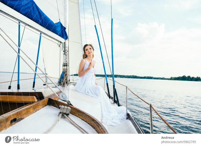 young girl on deck of sailing wooden yacht white day summer walk swim river sea water dress together waves wind blue sky depth