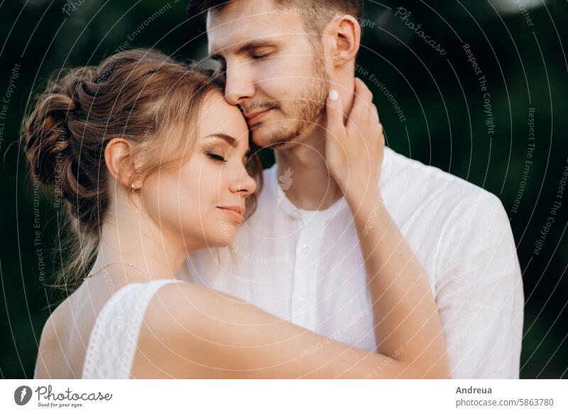 girl in a white sundress and a guy in a white shirt on a walk at sunset with a bouquet brown day earth forest forever freedom grass green horse lavender love