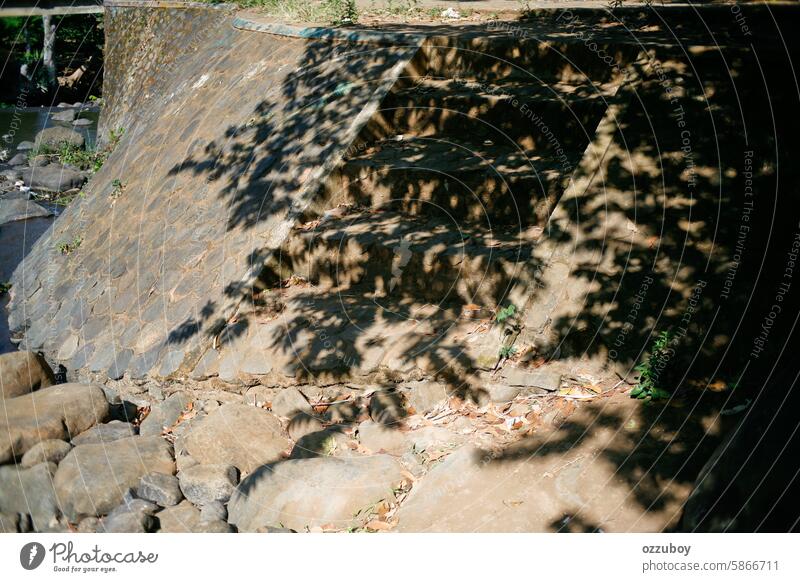 Shadows of leaves and twigs on the walls and stone steps on sunny day no people color image shadow abstract outdoors copy space sunlight architecture tree