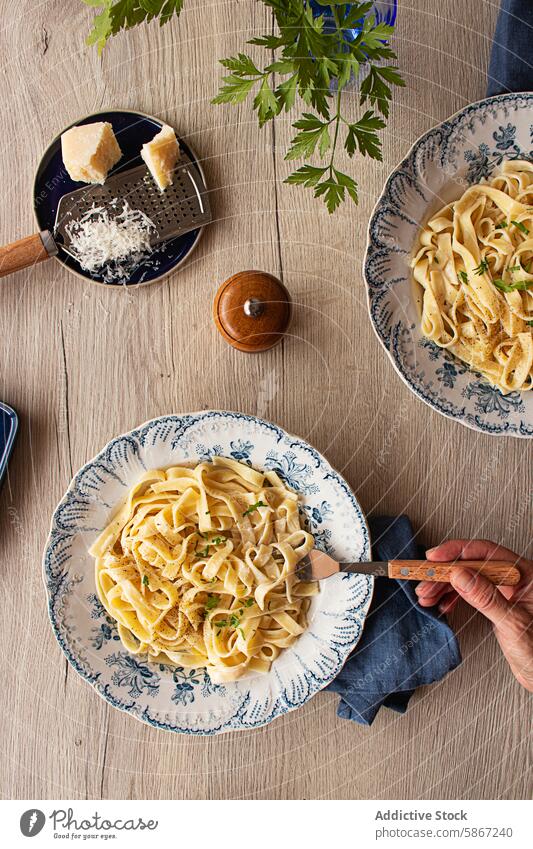 Delicious Italian pasta dish with creamy Alfredo sauce, garnished with parsley and parmesan mediterranean anonymous italian american herb styling soft