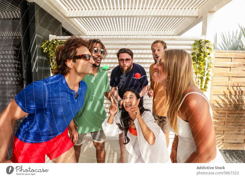 Summer fun with diverse group of excited friends outdoors summer cheerful laughing pointing sunny happiness gathering excitement casual party diversity