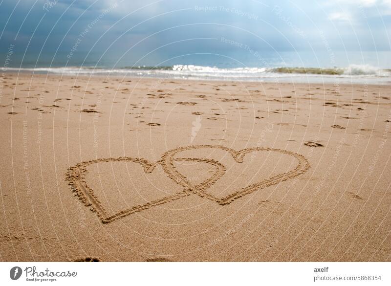 Two hearts on the beach Love Heart cuddle Beach Ocean vacation Water Waves Sky Sun Sunlight Sunbeam Sand Romance Relaxation Freedom dream dreams Far-off places