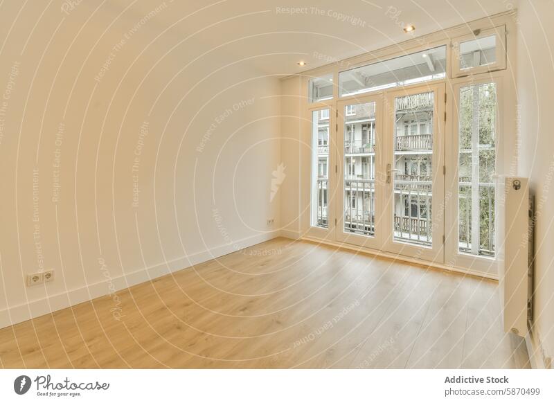 A living room with wood floors and a large window apartment modern interior bright wooden neutral wall spacious kanaalstraat netherlands clean design minimalist