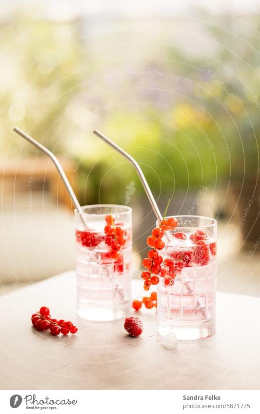 2 glasses of cold drinks and berries on a terrace Glass Alcoholic drinks Beverage Cocktail Longdrink Cold drink Lemonade Ice cube Refreshment Summer Delicious