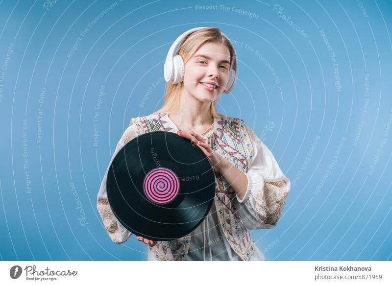 Young Blonde Woman With Vinyl Record Disc. Hobby, Music Lover, Collection 40s addict adult album analog attractive audio browsing buy choice choosing classic