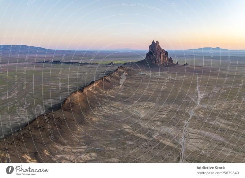 Aerial view of Shiprock at dusk in New Mexico, USA shiprock aerial view new mexico desert formation natural monument landscape united states rocky landmark