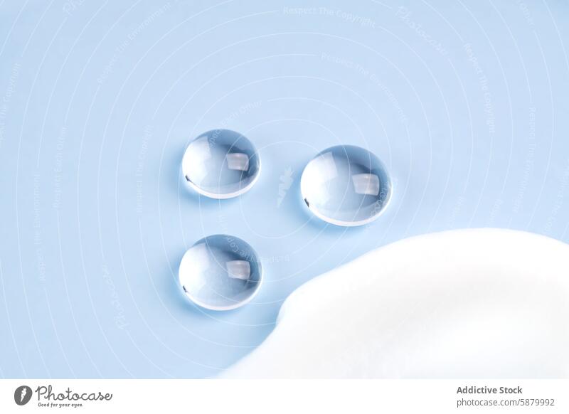 Cosmetic smears and translucent globes on a soft blue background cosmetic aesthetic skincare product beauty delicate tint muted symbol abstract design