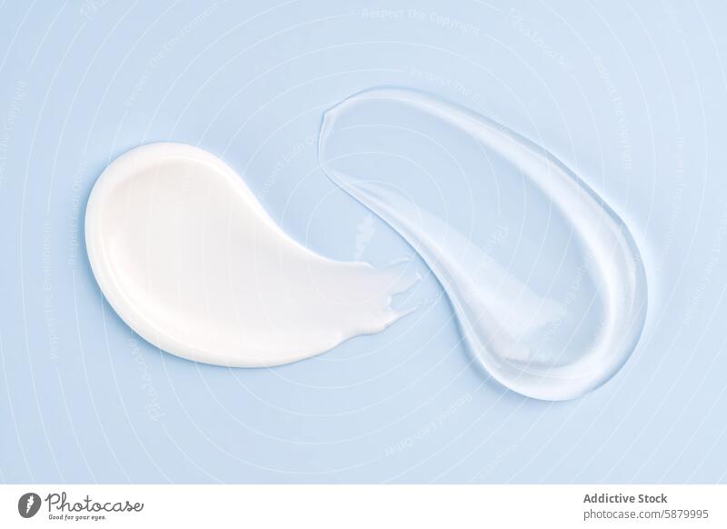 Cosmetic smears of cream presented on a blue background cosmetic skincare smooth glossy texture product beauty minimal clean simple elegant marketing