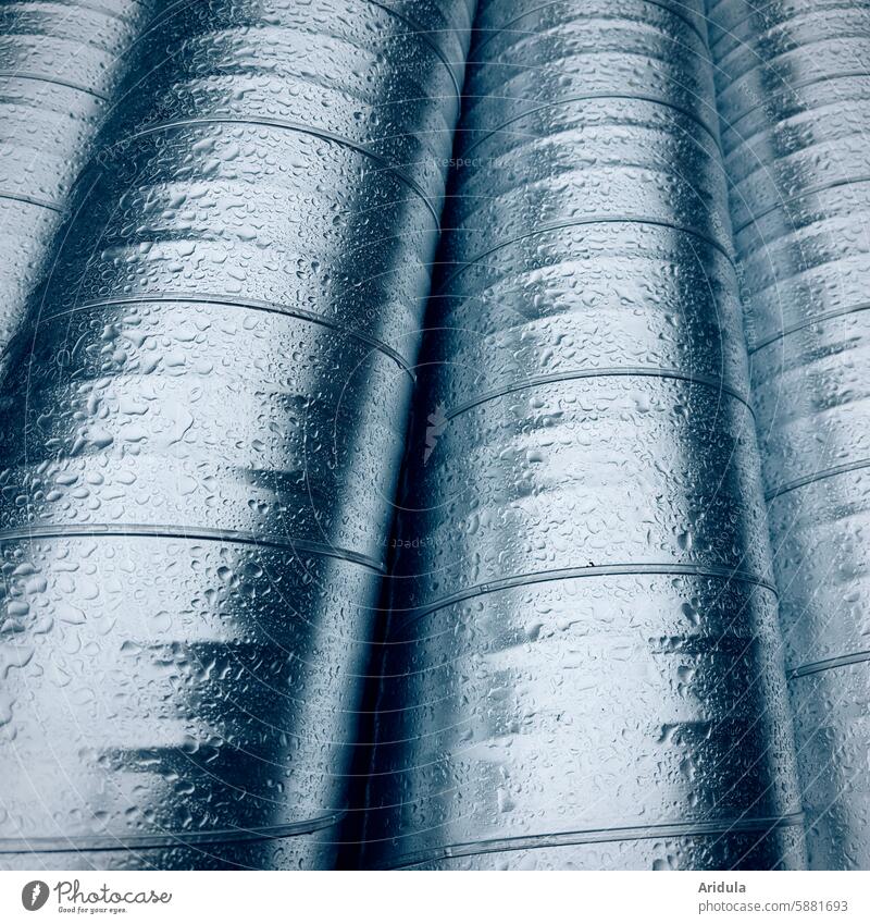 Galvanized spiral ducts in the rain Ventilation conduit Winding tube Ventilation system conversion refurbishment Building Architecture zinc zinc-plated