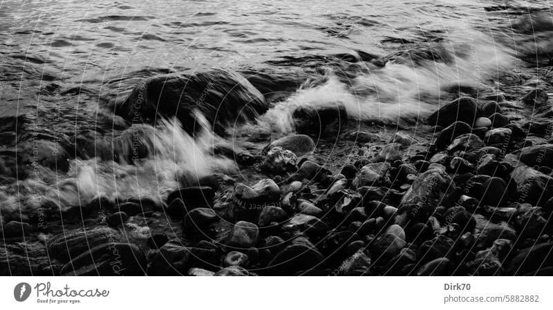 Baltic Sea waves break motionless on the stony beach Beach Waves breaking wave To break (something) Stone stones motion blur Sea water Water Ocean Swell