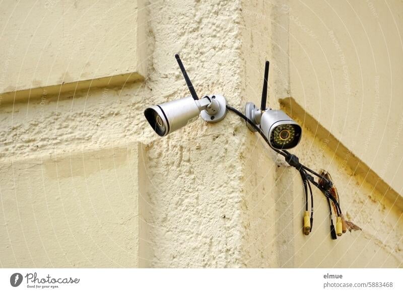 Two surveillance cameras on the corner of a house Surveillance camera Security camera outdoor camera Cable Terminal connector Observe burglar alarm Blog