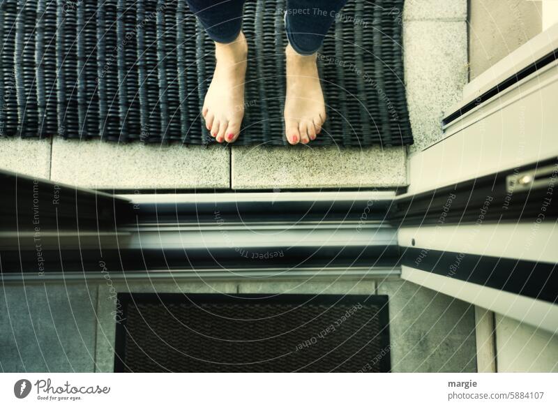 In or out? door Open feet Doormat run barefoot Women's Feet stopped Barefoot front door segregated double-walled Sliding door Legs Toes Nail polish Human being