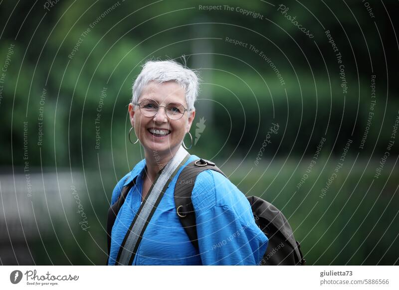 UT Leipzig - cheerful to cloudy | Happy and content | Beautiful, active, older woman hiking in nature portrait Woman Exterior shot Authentic Earring Eyeglasses