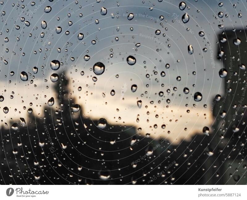 Rainy day with bright sections observed through the window pane Regeneration raindrops Wet Comfortless rainy bad wet Drop couch weather Clouds Window urban Sky