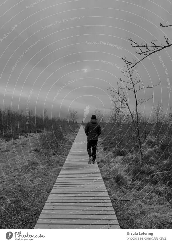 Man walking along the jetty Human being person Black & white photo black-and-white Black and white photography black-white Footbridge melancholy somber