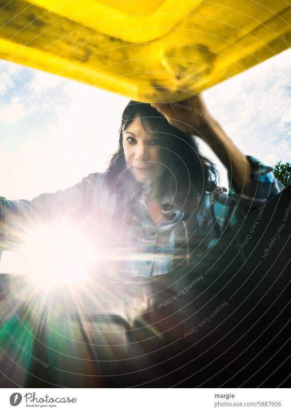 A woman opens the yellow garbage can Woman Trash container dustbin waste Dispose of Recycling Waste management yellow ton Throw away throwaway society