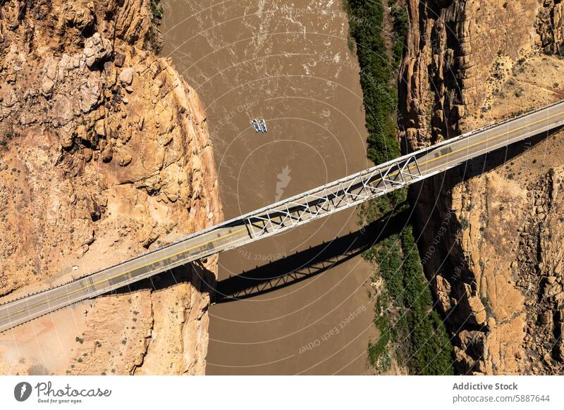 Aerial view of bridge and raft on river at White Canyon, USA aerial view white canyon usa landscape nature outdoor water steel bridge travel from above scenery