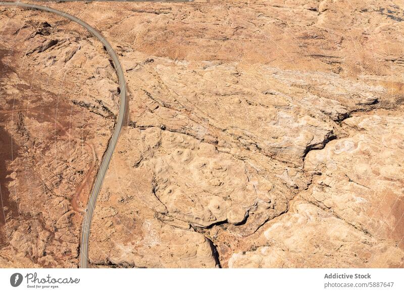 Aerial view of winding road through White Canyon, USA aerial view white canyon glen canyon national recreation area usa landscape geological rugged terrain