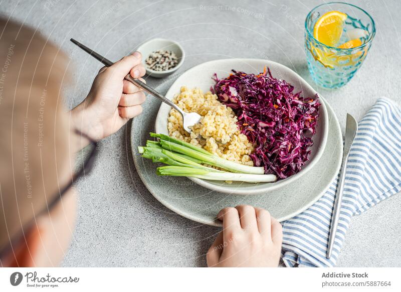 Healthy lunch with red cabbage salad and boiled bulgur food healthy carrot green onion bowl colorful fresh raw fluffy nutritious meal vegetable grain diet fiber