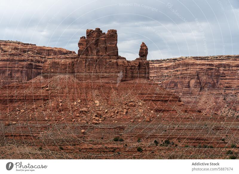 Towering rock formations in Valley of the Gods, Utah valley of the gods utah scenic landscape geology nature travel tourism desert sandstone overcast sky rugged