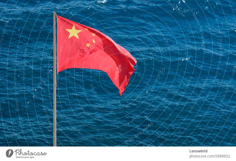 Chinese national flag at the coast near the sea asia banner blue china china national flag chinese chinese flag conflict country flagpole ocean pacific